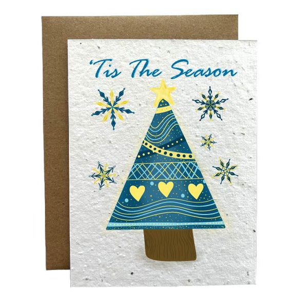 Plantable Greeting Card featuring nordic themed, yellow and blue snowflakes and triangle shaped Christmas Tree. Printed on seed paper that grows wildflowers when planted."