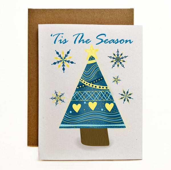 Eco-Friendly Greeting Card featuring nordic themed, yellow and blue snowflakes and triangle shaped Christmas Tree. Printed on 100% recycled cardstock.