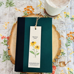 Hand drawn Black Eyed Susan flower on a plantable bookmark. Flowers and link for growing instructions printed on bottom of bookmark