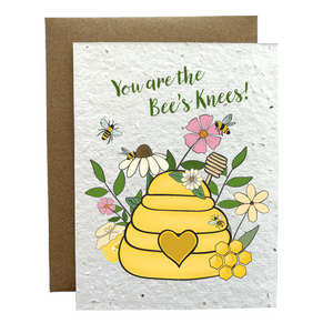 Plantable greeting card with a yellow beehive and flowers, featuring the text 'You are the Bee's Knees!'.