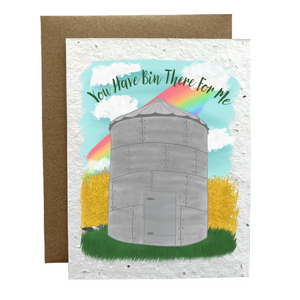 Card with a grain bin illustration with a wheat field, blue sky and rainbow in the background, featuring text 'You Have Bin There For Me'.